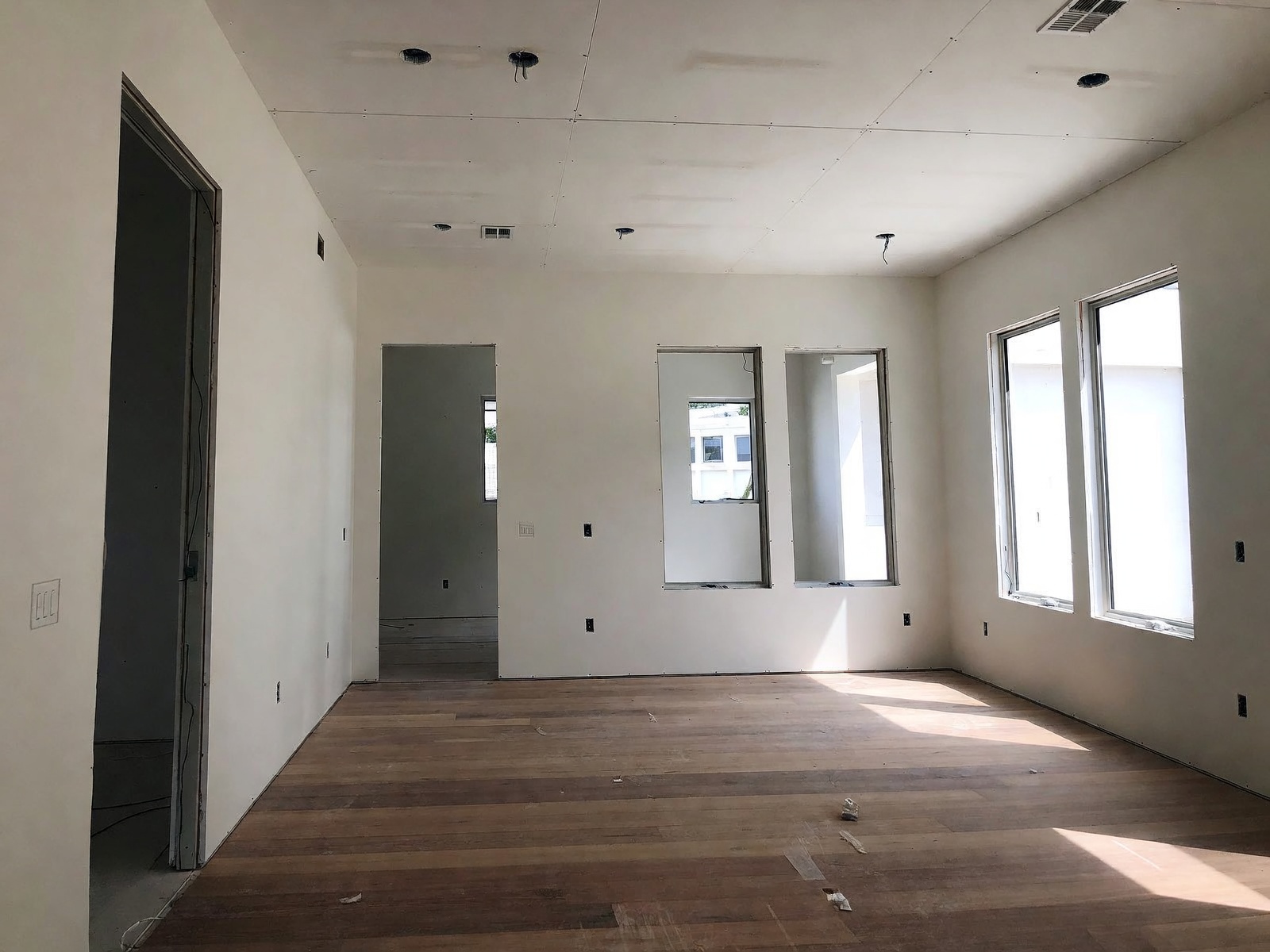 Finish-stage interior with trim, flooring, and Florida light